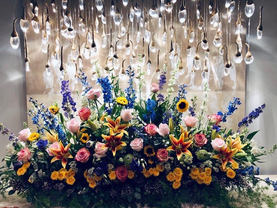Floral Arrangement under several small lights